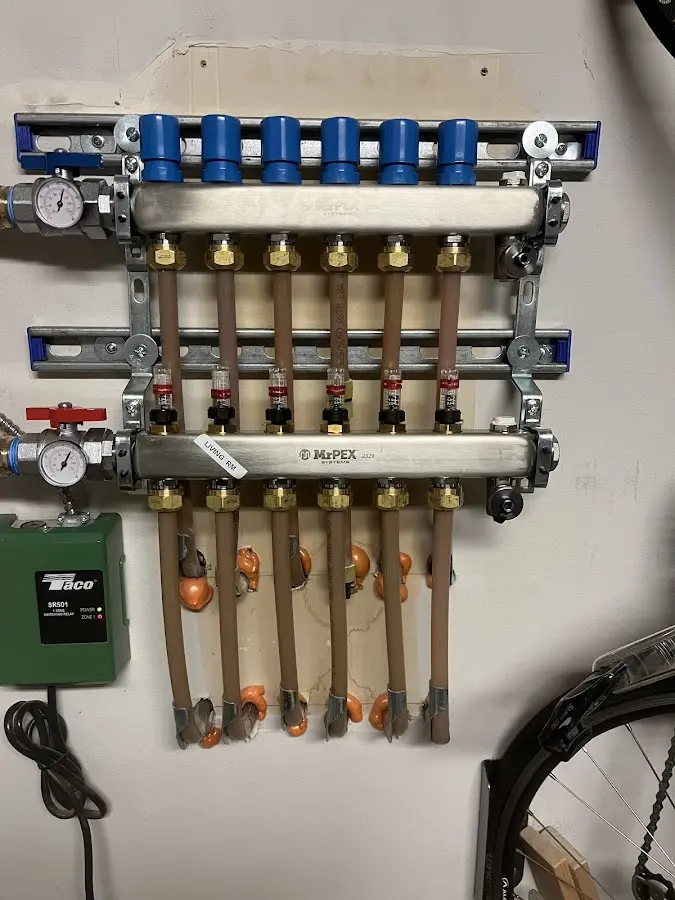 Plumber performing Water Heater Repair at a residential property in Prairie Village